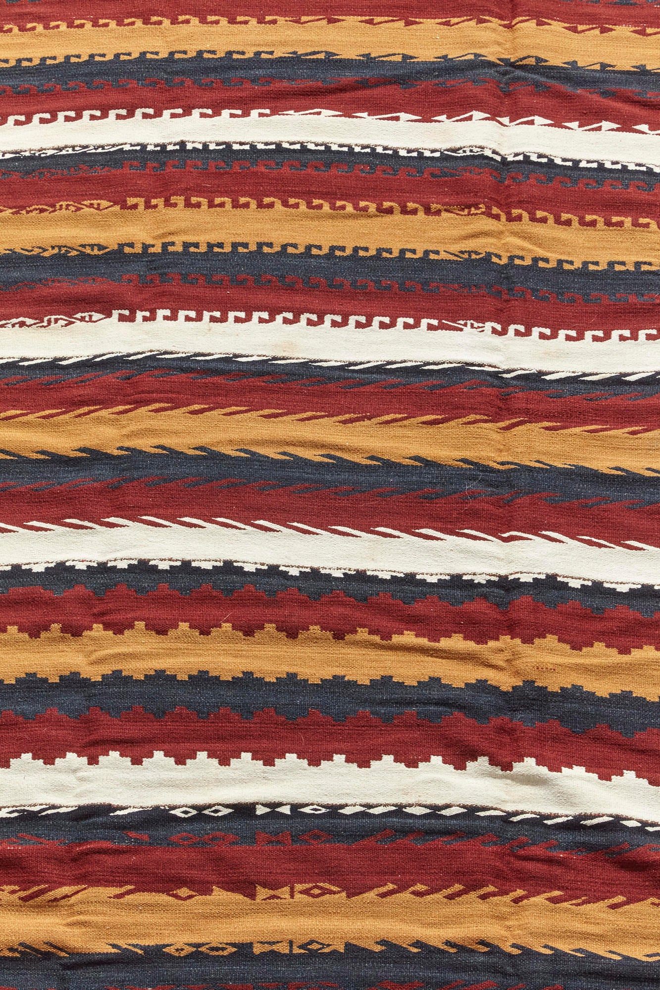 Antique Kilim Turkish rug with red, grey, gold and cream stripes. Hand woven piece, perfect for a living room, bedroom or kitchen - Available from King Kennedy Rugs Los Angeles