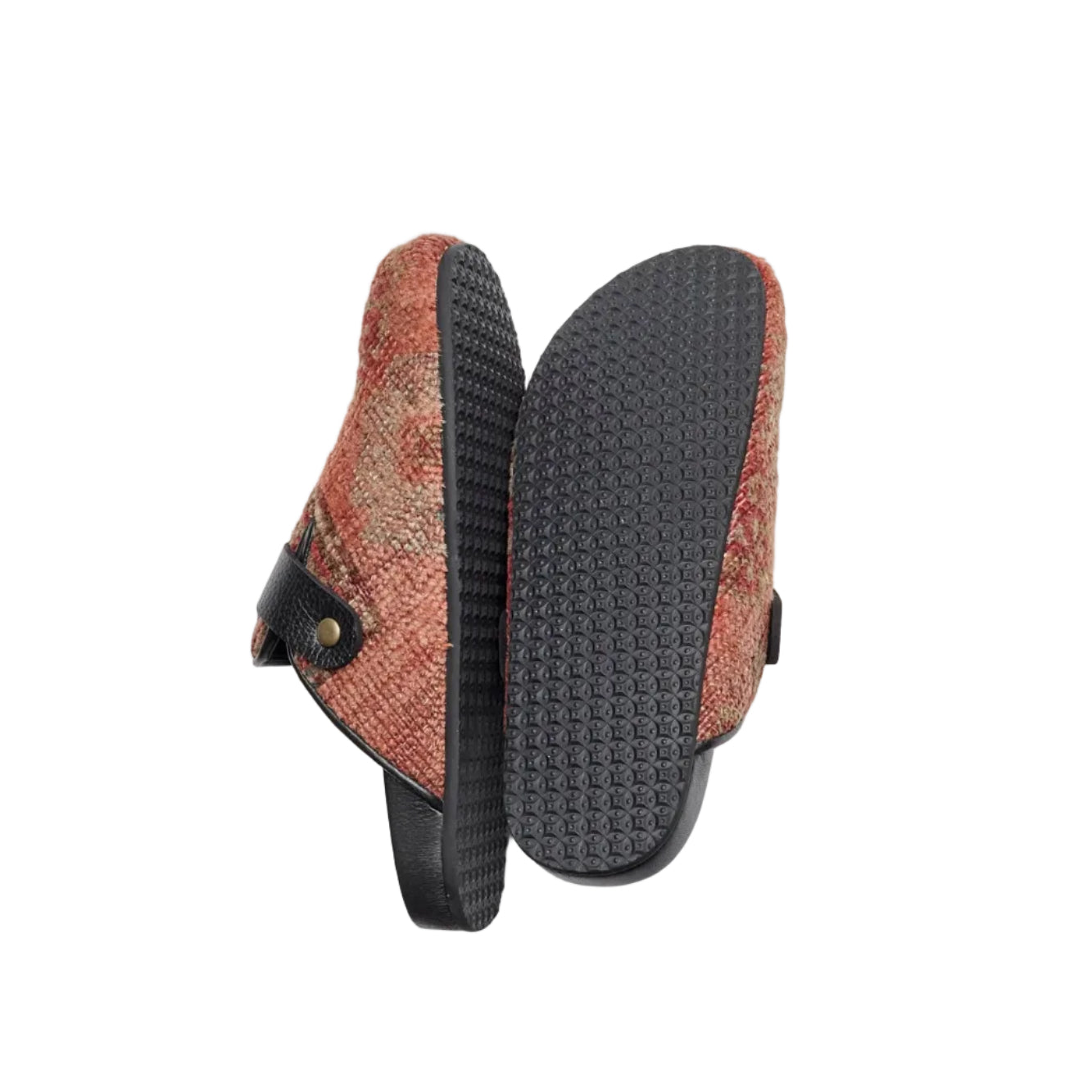Rubber sole of rug mules. King Kennedy Rug Mules are one-of-a-kind and made of 100 year old antique Persian rug fragments with soft lambskin footbed and comfortable rubber sole. This pair is made of an antique hand knotted Persian rug with pink, red and yellow tones.