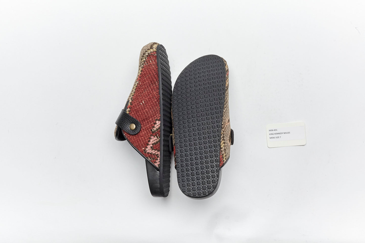 Rubber sole of rug mules. King Kennedy Rug Mules are one-of-a-kind and made of 100 year old antique Persian rug fragments with soft lambskin footbed and comfortable rubber sole. This pair is made of an antique hand knotted Persian rug with taupe base and pink, cream and tan patterns.
