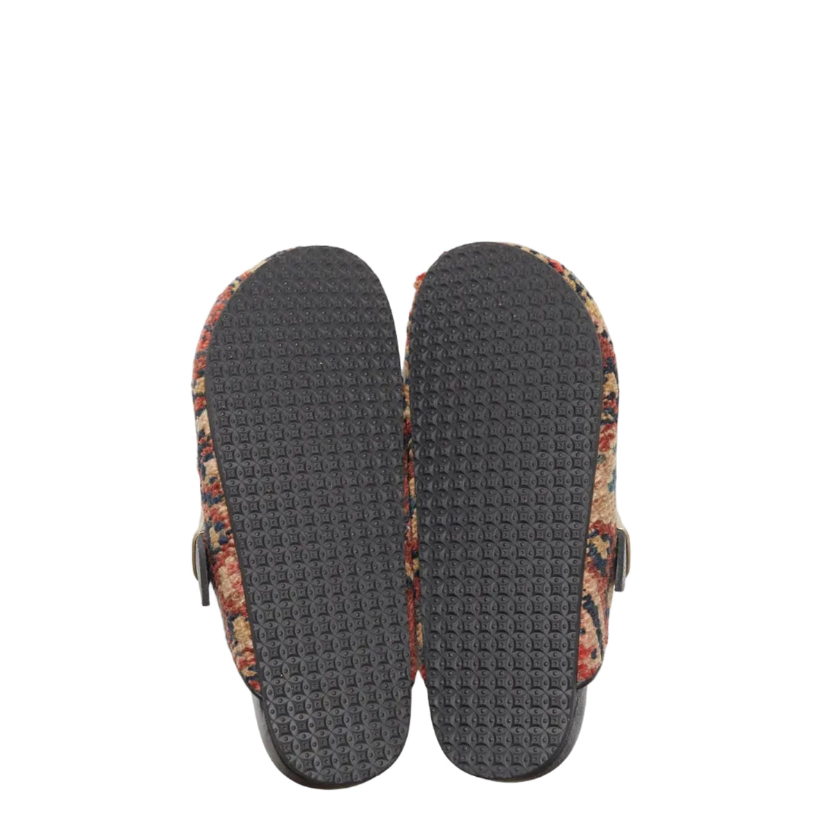 Rubber soles of rug mules. Side view of rug mules. This pair of King Kennedy Rug Mules are one-of-a-kind and made of 100 year old antique Persian rug fragments with soft lambskin footbed and rubber sole. This pair is made of a taupe, beige rug with pale red and blue designs.