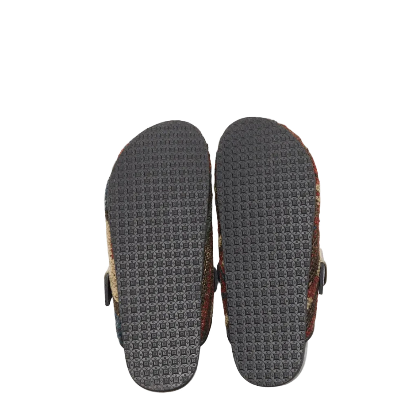 Pictured here is the rubber sole on a pair of King Kennedy Rug Mules. Pictured here is the side view of the King Kennedy Rug Mules. King Kennedy Rug Mules are one-of-a-kind and made of 100 year old antique Persian rug fragments with soft lambskin footbed and rubber sole. This pair is made of an antique Persian rug with patterns in deep earth tones of brown, green, cream and blue. Made in Los Angeles.
