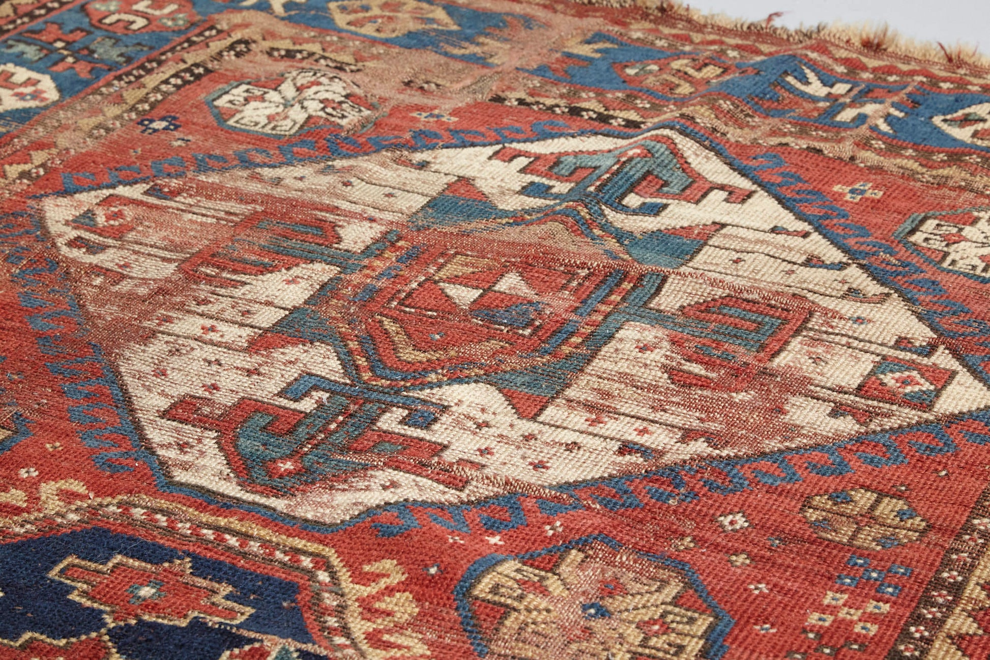 Beautifully worn antique Kazak Persian Rug with red, blue and cream colors - Available from King Kennedy Rugs Los Angeles