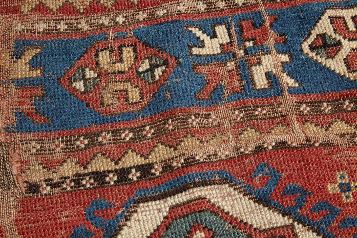 Beautifully worn antique Kazak Persian Rug with red, blue and cream colors - Available from King Kennedy Rugs Los Angeles