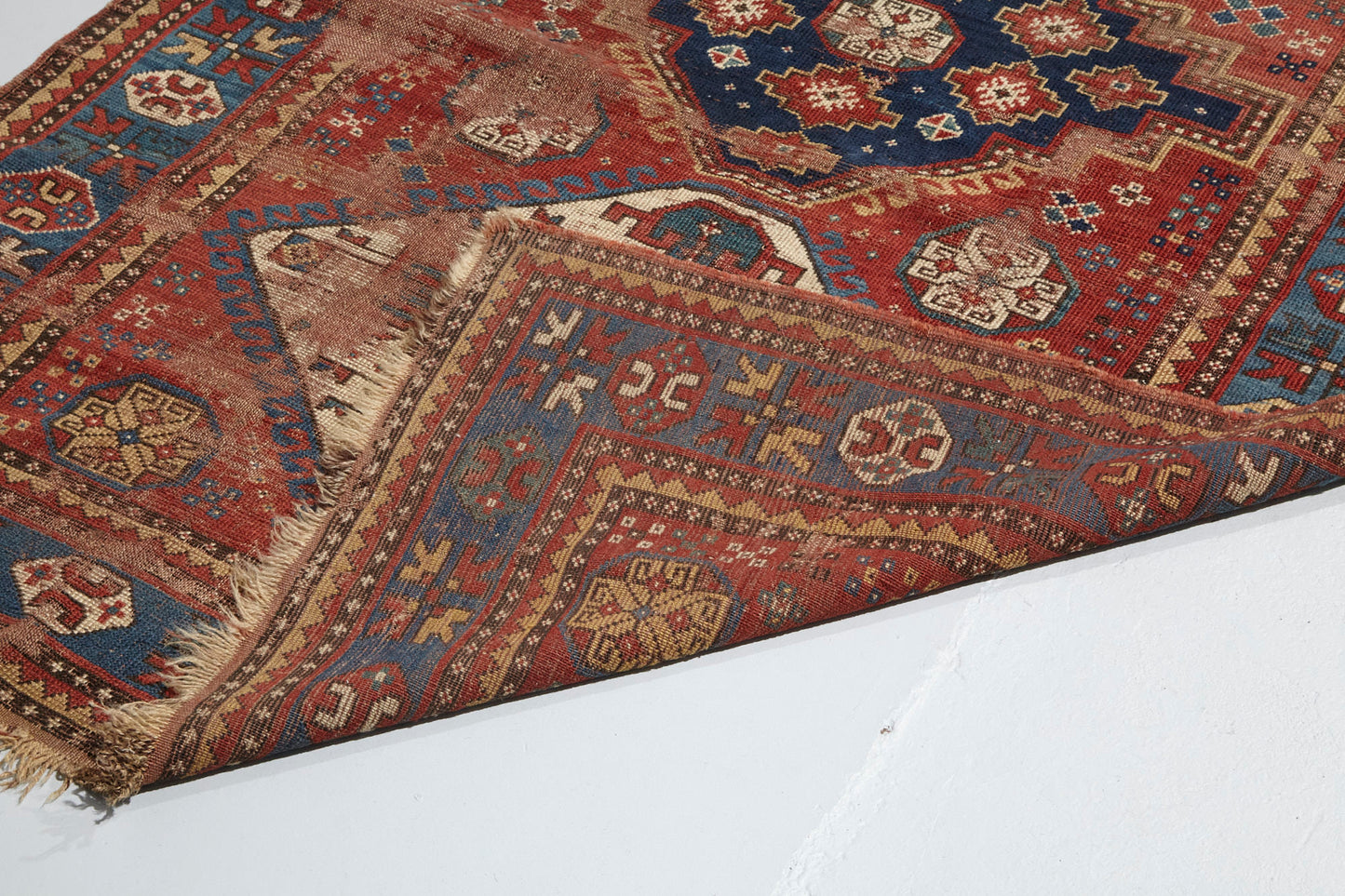 Front and back of beautifully worn antique Kazak Persian Rug with red, blue and cream colors - Available from King Kennedy Rugs Los Angeles