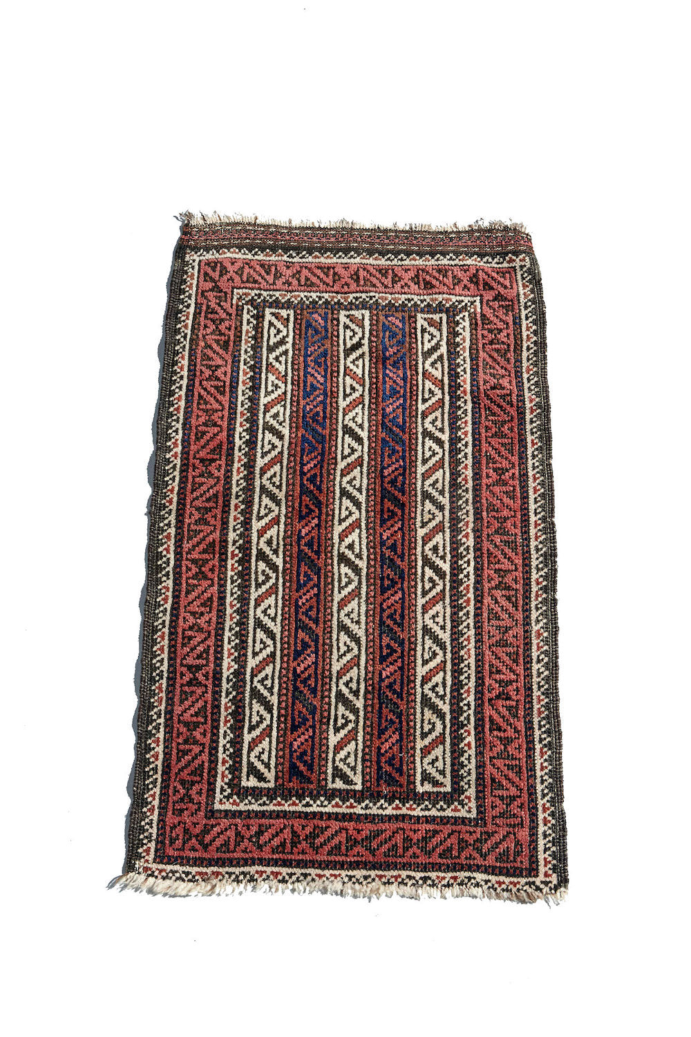 Baluch Persian Rug. Hand woven antique rug with zig zag patterns in cream and pink. Perfect for a bathroom, kitchen, bedroom or study. Available from King Kennedy Rugs Los Angeles