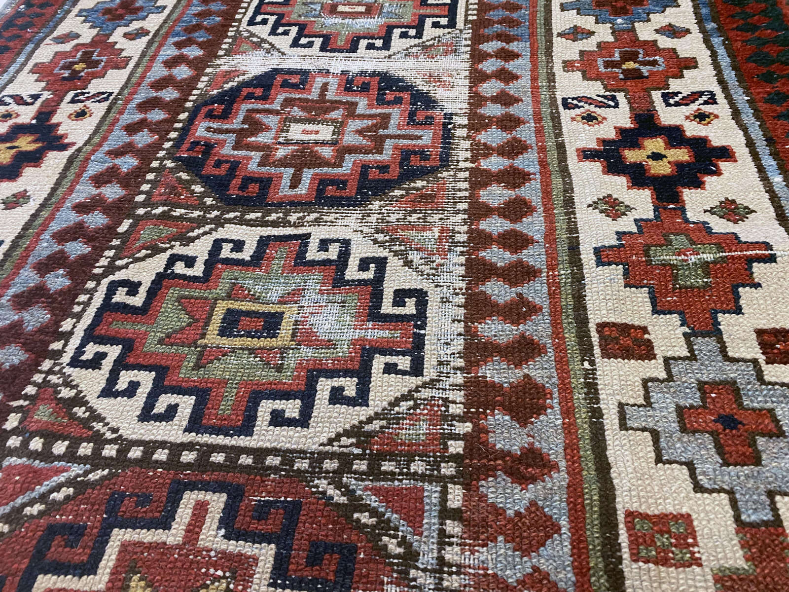 Red and cream Persian rug runner with bright red, blue, green and gold geometric patterns - available from King Kennedy Rugs Los Angeles