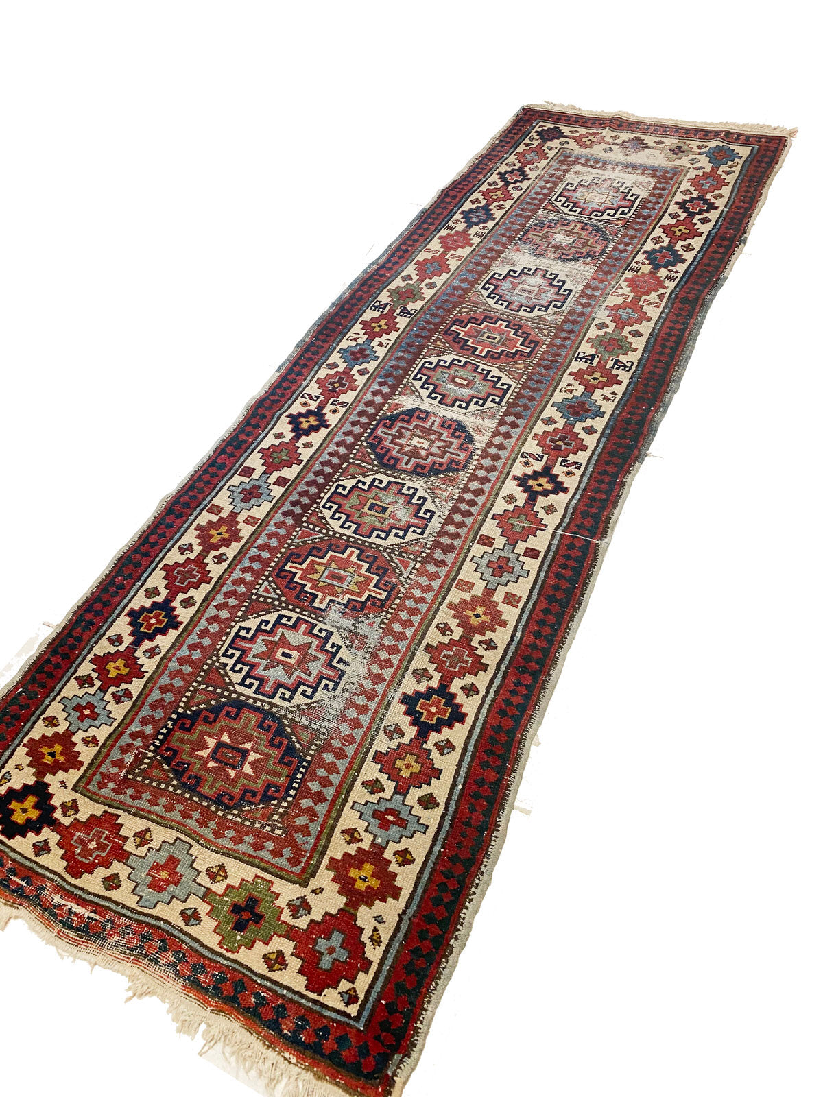 Red and cream Persian rug runner with bright red, blue, green and gold geometric patterns - available from King Kennedy Rugs Los Angeles