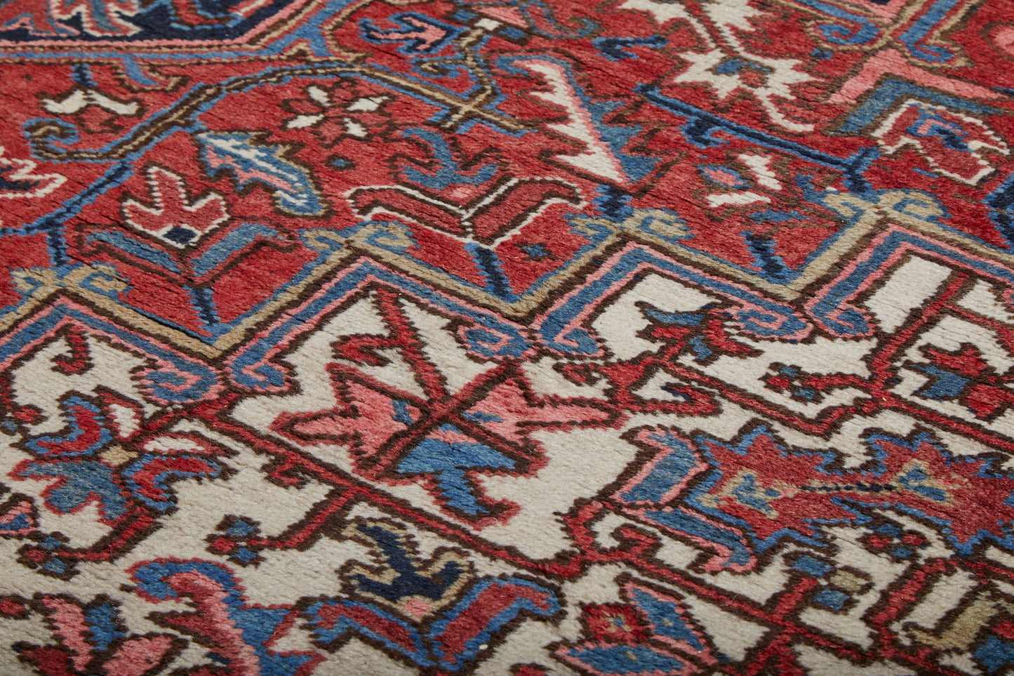Close-up of thick soft pile of Red, Pink, Blue and White hand woven Heriz sampler Persian Rug - Available from King Kennedy Rugs Los Angeles