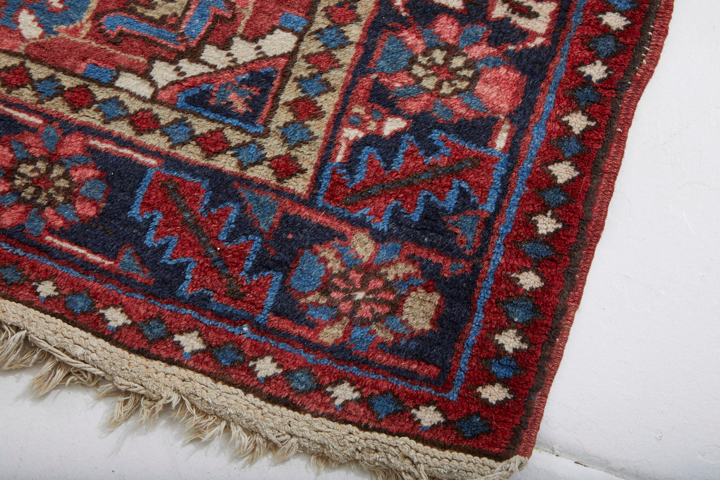 Detail of border - Red, Pink, Blue and White hand woven Heriz sampler Persian Rug - Available from King Kennedy Rugs Los Angeles