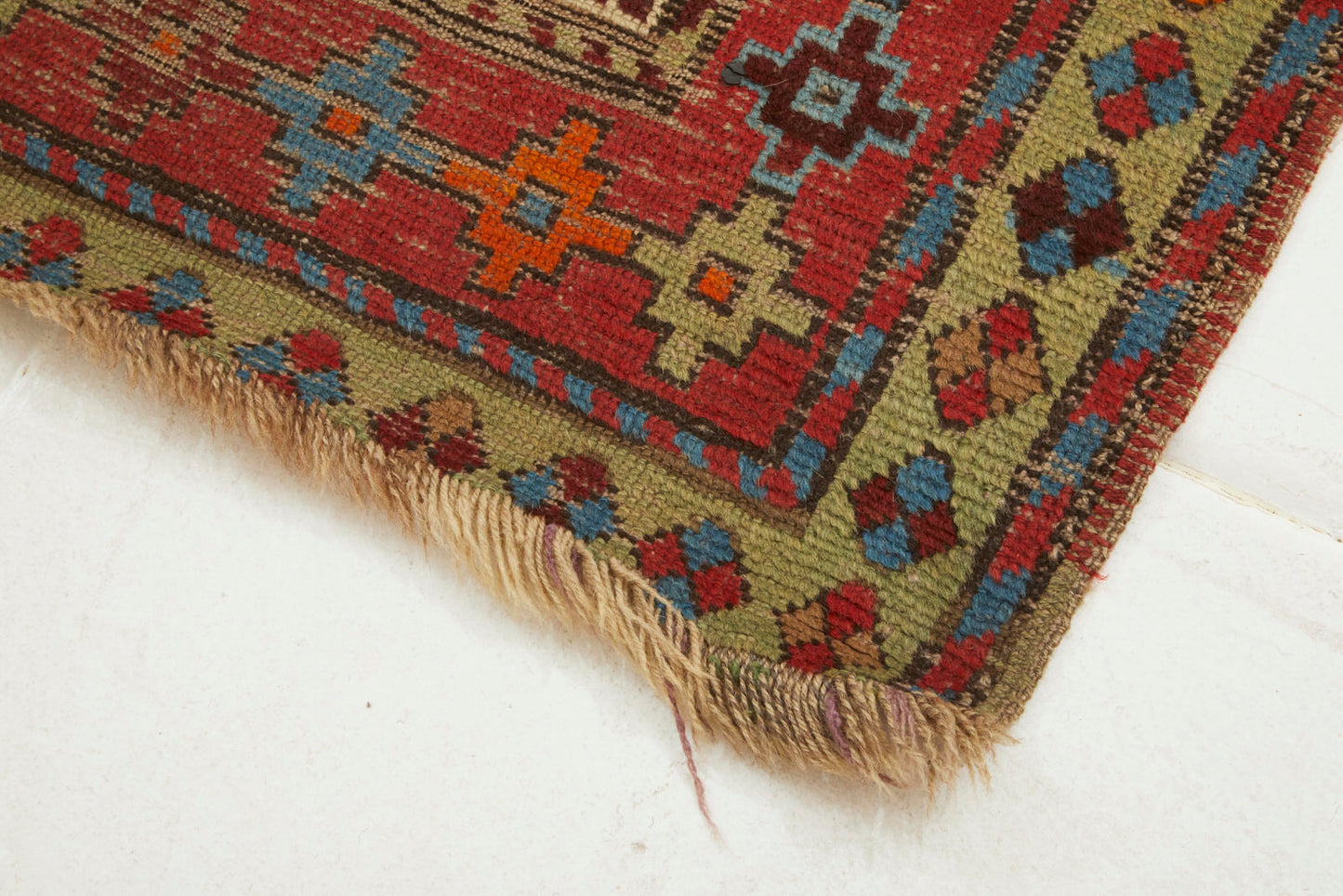 Kazak Persian Caucasian Rug with red, brown, blue and orange colors vailable from King Kennedy Rugs Los Angeles 