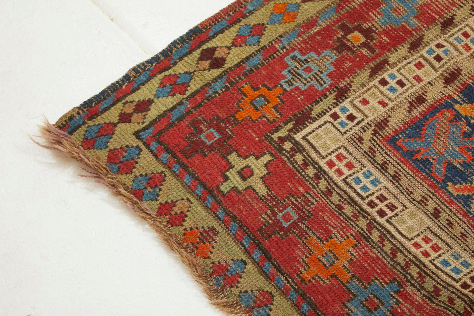 Kazak Persian Caucasian Rug with red, brown, blue and orange colors Available from King Kennedy Rugs Los Angeles 