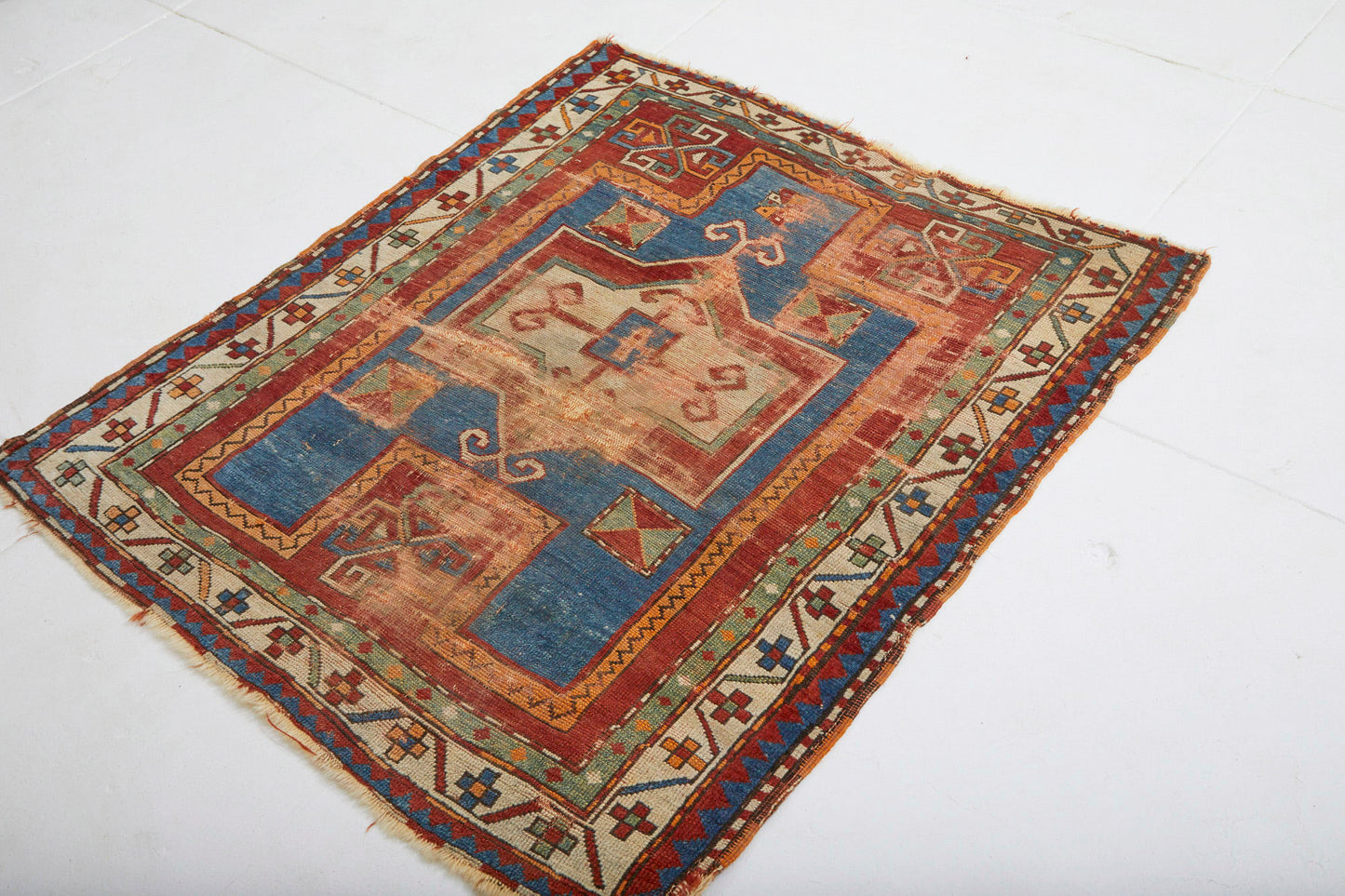 Antique Kazak Persian Rug with red, tan, blue and cream colors - Available from King Kennedy Rugs Los Angeles
