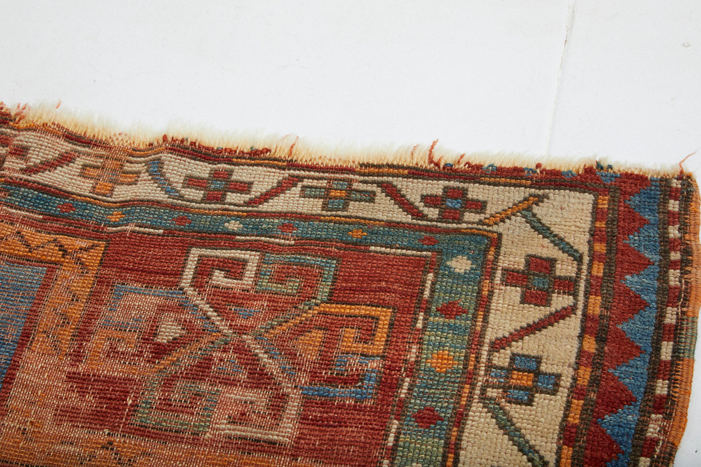 Antique hand woven Kazak Persian Rug with red, tan, blue and cream colors - Available from King Kennedy Rugs Los Angeles
