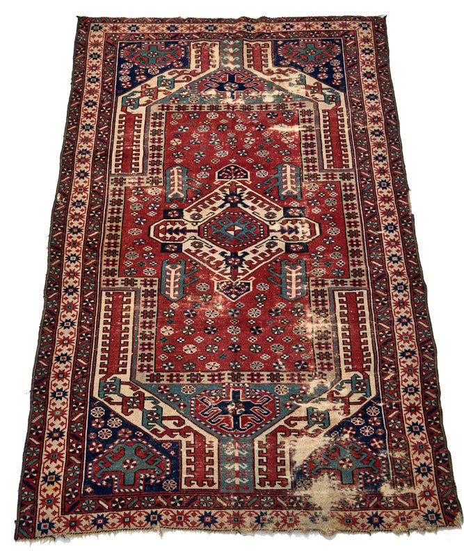 Intricate handwoven Kazak red, cream, dark blue and green Persian area rug - available from King Kennedy Rugs Los Angeles