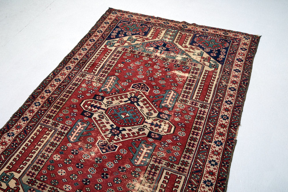 Intricate hand woven Kazak red, cream, dark blue and green Persian area rug - available from King Kennedy Rugs Los Angeles