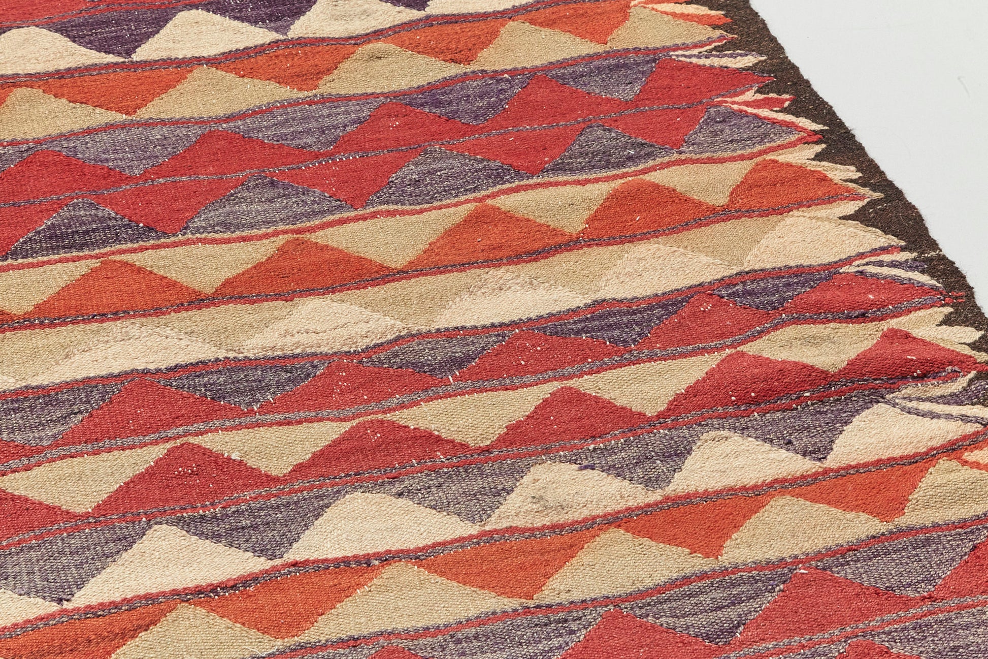 Hand woven flat weave Kilim Turkish Rug with beige, red and grey triangle shapes - Perfect for bedroom, kitchen, dining or living room rug - Available from King Kennedy Rugs Los Angeles