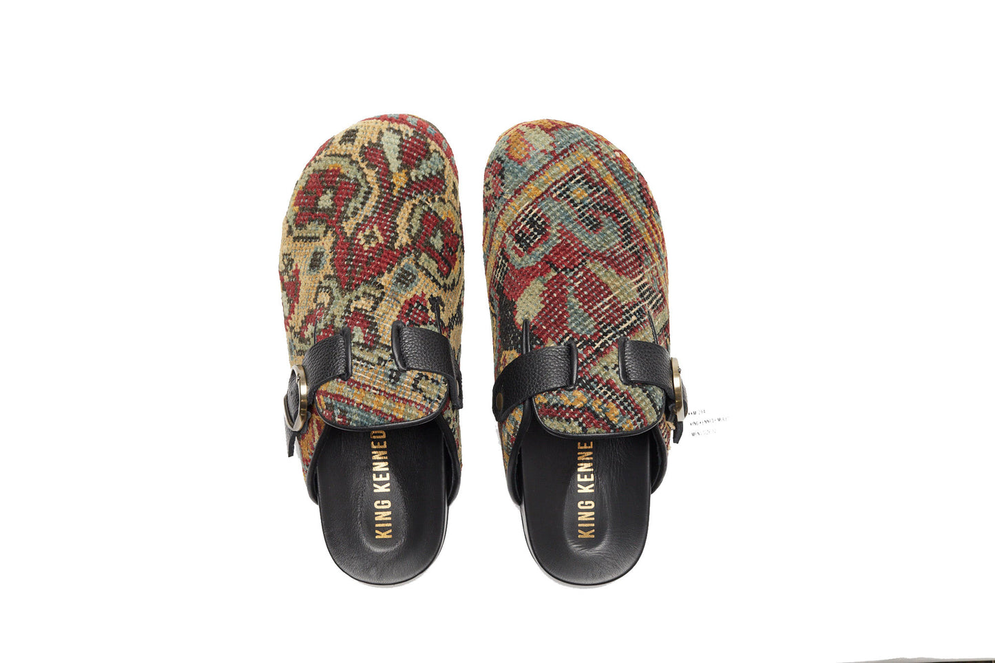 King Kennedy Rug Mules are one-of-a-kind and made of 100 year old antique Persian rug fragments with soft lambskin footbed and comfortable rubber sole. This pair is made of an antique Persian rug with gold, red and faded blue patterns. 