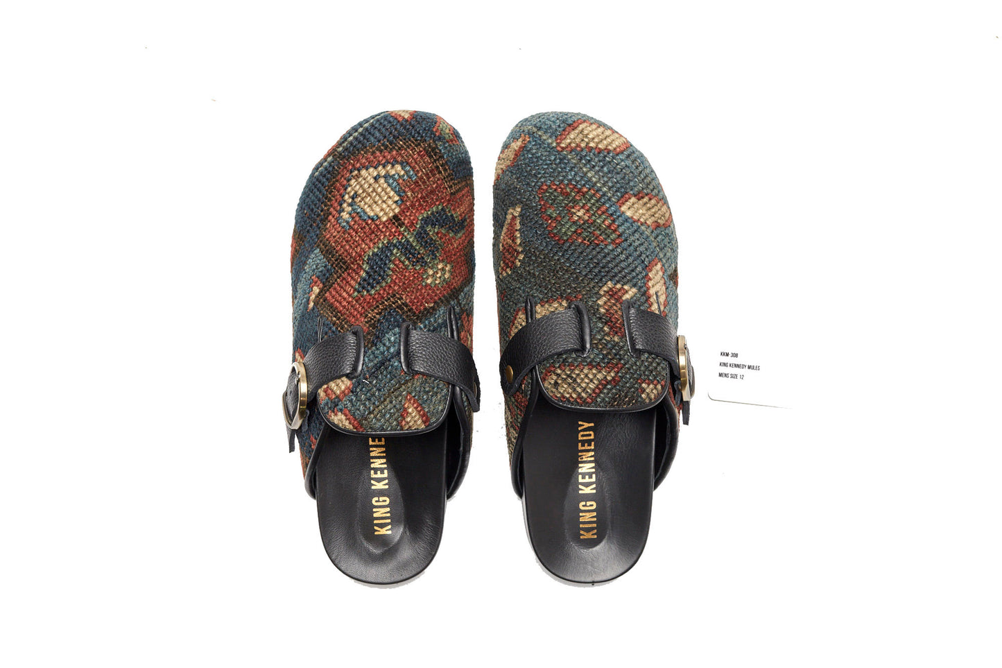 King Kennedy Rug Mules are one-of-a-kind and made of 100 year old antique Persian rug fragments with soft lambskin footbed and comfortable rubber sole. This pair is made of a beautifully faded antique Persian rug featuring a blue base with pale red, cream and green floral motifs. 