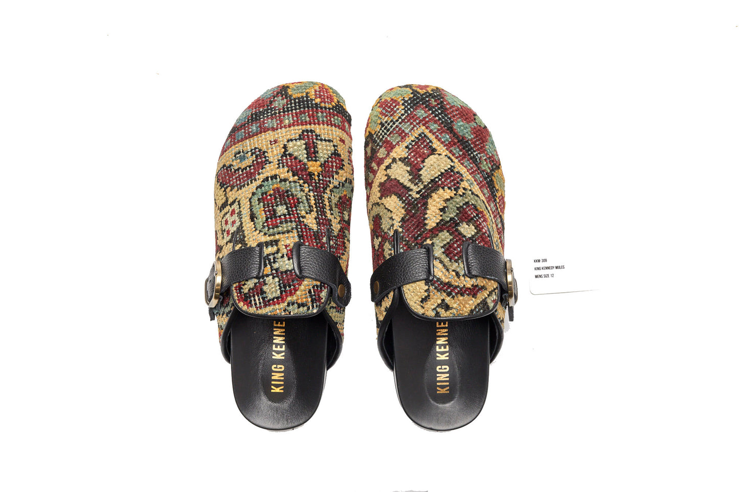 King Kennedy Rug Mules are one-of-a-kind and made of 100 year old antique Persian rug fragments with soft lambskin footbed and comfortable rubber sole. This pair is made of an antique Persian rug featuring a pale yellow gold base with faded green, red and blue floral motifs. 