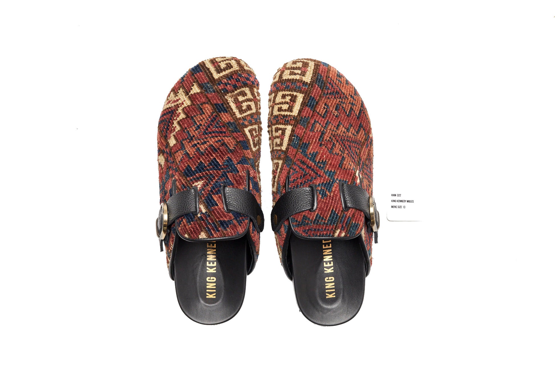 King Kennedy Rug Mules are one-of-a-kind and made of 100 year old antique Persian rug fragments with soft lambskin footbed and comfortable rubber sole. This pair is made of an antique Persian rug with a beautifully faded red base, cream, blue and amber design motifs.  