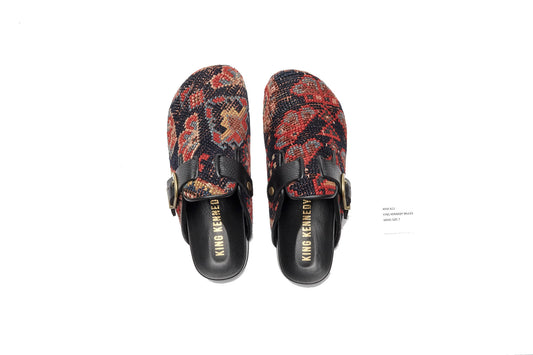 King Kennedy Rug Mules are one-of-a-kind and made of 100 year old antique Persian rug fragments with soft lambskin footbed and comfortable rubber sole. This pair is made of an antique Persian rug with dark blue base, and red, blue and gold floral motifs. 
