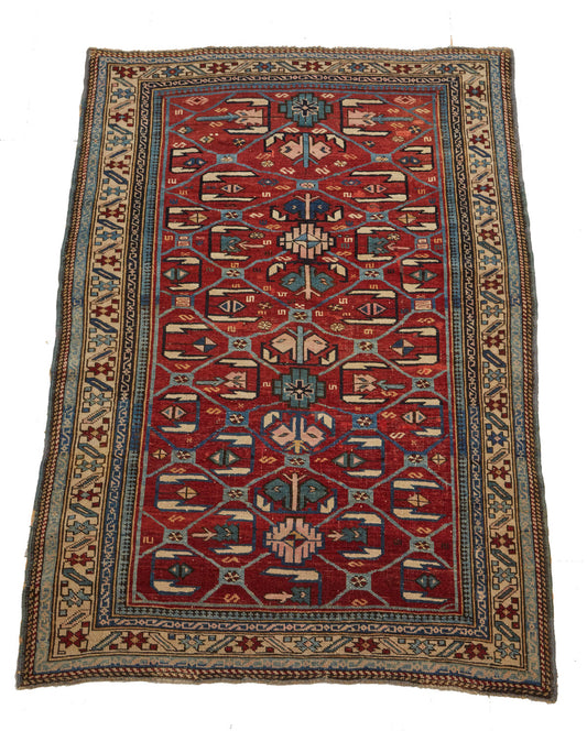 Intricately hand woven  Kuba Dragon Antique Persian Rug - red base with blue, cream and pink designs - King Kennedy Rugs Los Angeles