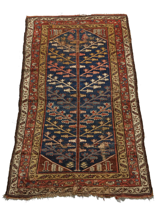 Kurdish antique Persian rug, hand woven with tree of life design on a blue background with gold, red, pink and cream branch and leaf designs throughout, would be beautiful in a bedroom, kitchen, hallway or living room - Available from King Kennedy Rugs Los Angeles