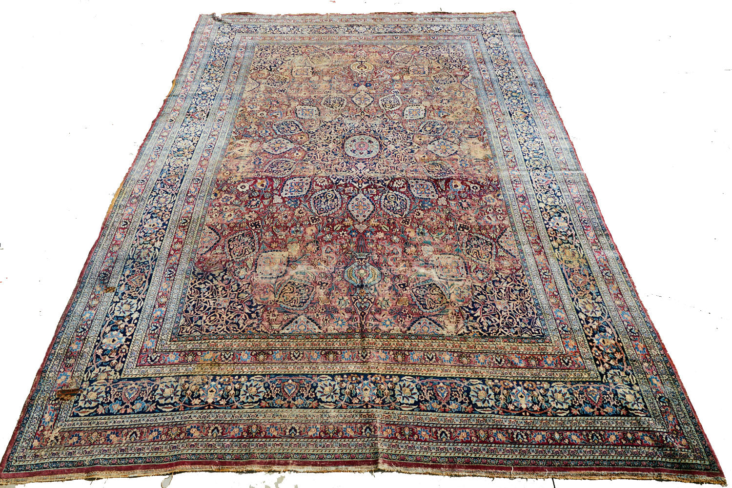 Hand woven antique room-sized Meshed Persian Rug with burgundy purple red base and blue, cream and gold intricately woven patterns of flowers and vines with large medallion in center - Available from King Kennedy Rugs Los Angeles