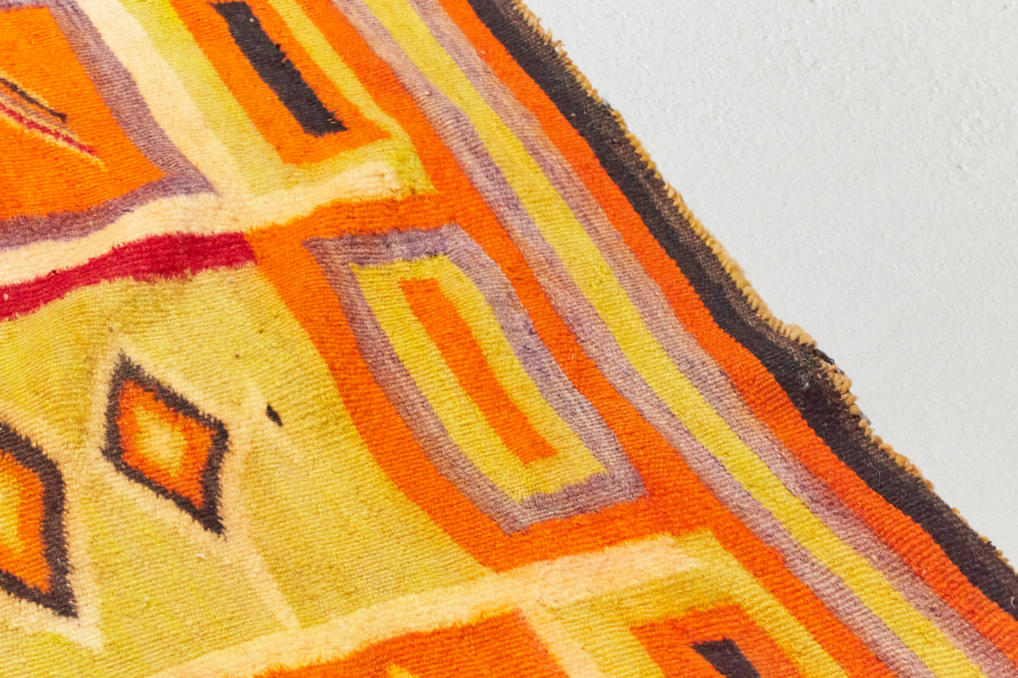 This Navajo Pound Blanket Transitional is a hand woven antique piece in vibrant red, orange and yellow natural dyes, with zig zags and diamonds throughout - Available from King Kennedy Rugs Los Angeles