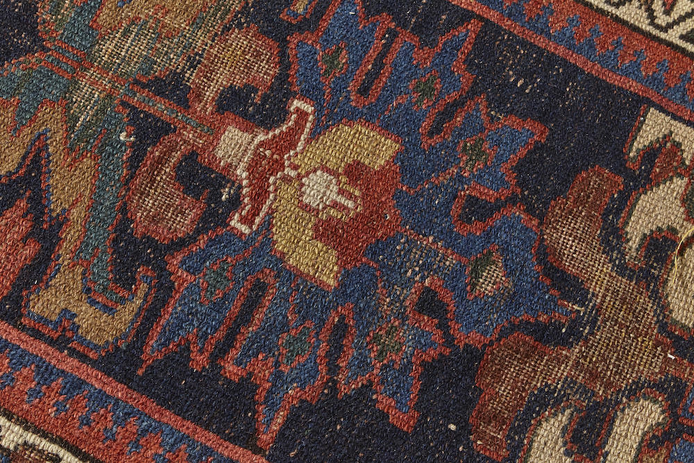 Persian Rug Runner, hand woven in deep blue with red, blue and cream floral motifs throughout. Perfect for a hallway or kitchen rug - Available from King Kennedy Rugs Los Angeles