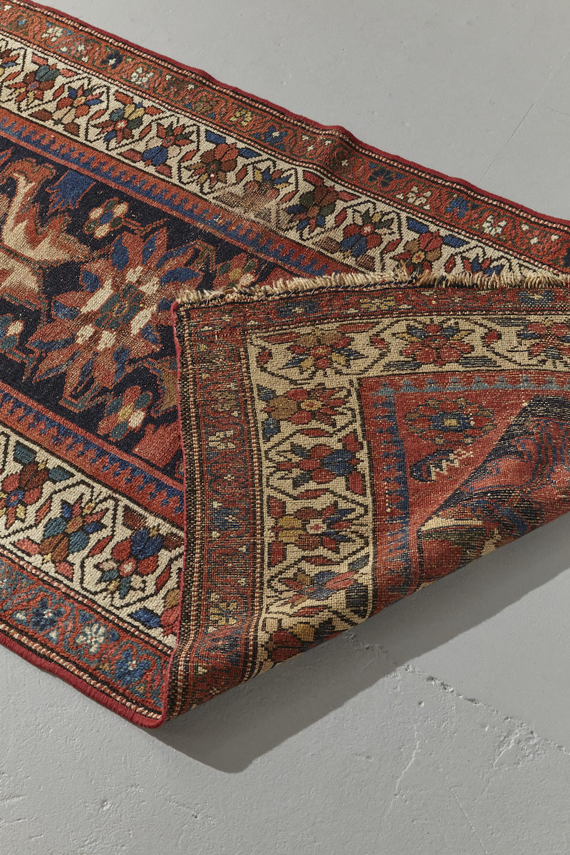 Persian Rug Runner, hand woven in deep blue with red, blue and cream floral motifs throughout. Perfect for a hallway or kitchen rug - Available from King Kennedy Rugs Los Angeles