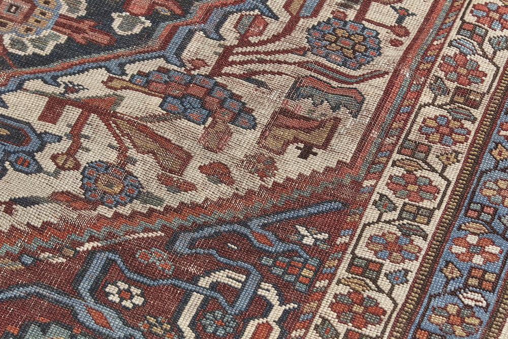 Detail of weave - Antique Persian Bakhtiari hand woven rug with blue, red and cream floral design. Perfect for dining room, living room or office. Available from King Kennedy Rugs Los Angeles