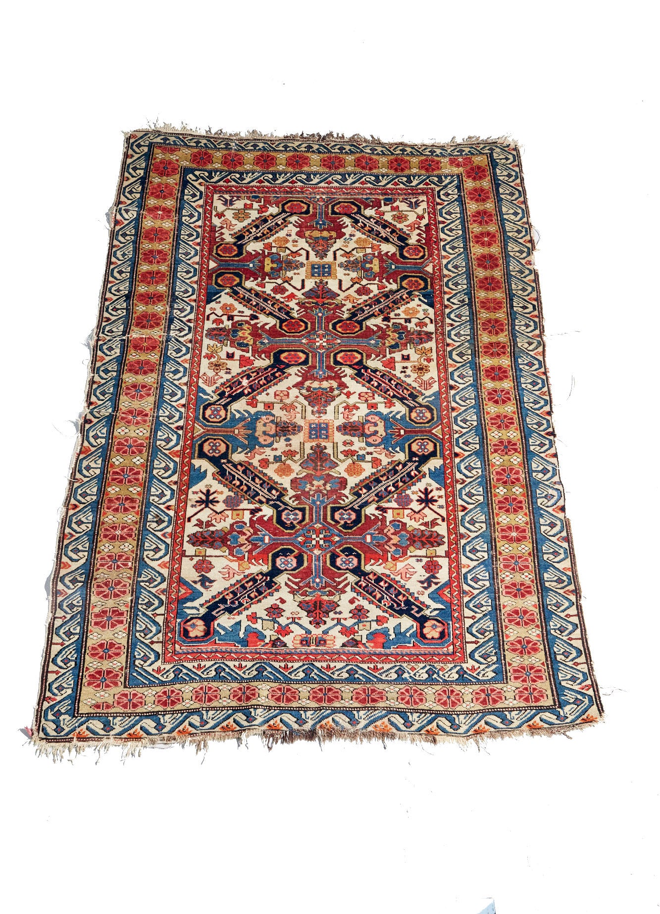 Exquisite, intricately woven Zeychour Persian rug. Vibrant red and deep blue medallions with floral motifs throughout and border with red flowers and blue and white wave pattern. Perfect for living room, bedroom or dining room or as wall hanging. Available from King Kennedy Rugs Los Angeles