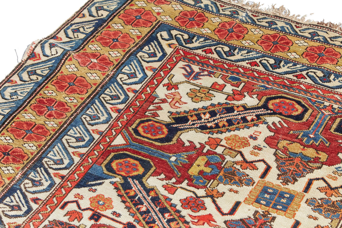 Exquisite, intricately woven Zeychour Persian rug. Vibrant red and deep blue medallions with floral motifs throughout and border with red flowers and blue and white wave pattern. Available from King Kennedy Rugs Los Angeles