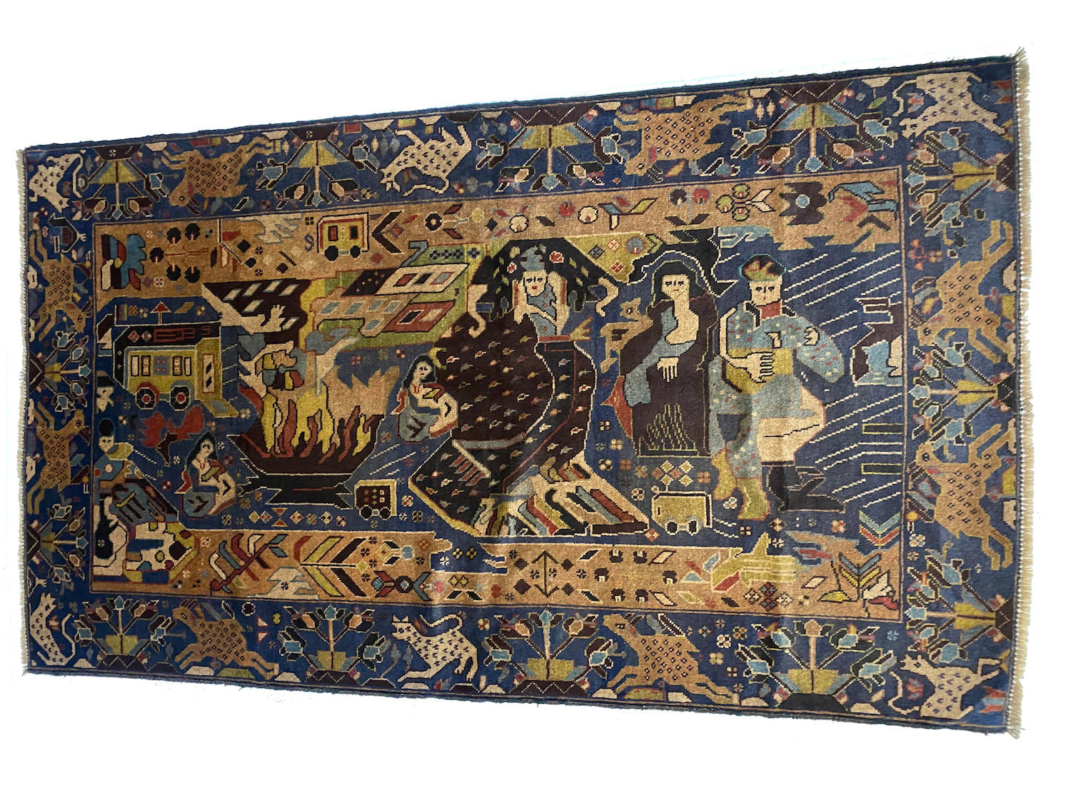 Detailed hand woven Afghan Pictorial Rug depicting figures around a fire near a caravan, along with  Deep blue hues with beige, black and pale green details of plants and animals. Available from King Kennedy Rugs Los Angeles