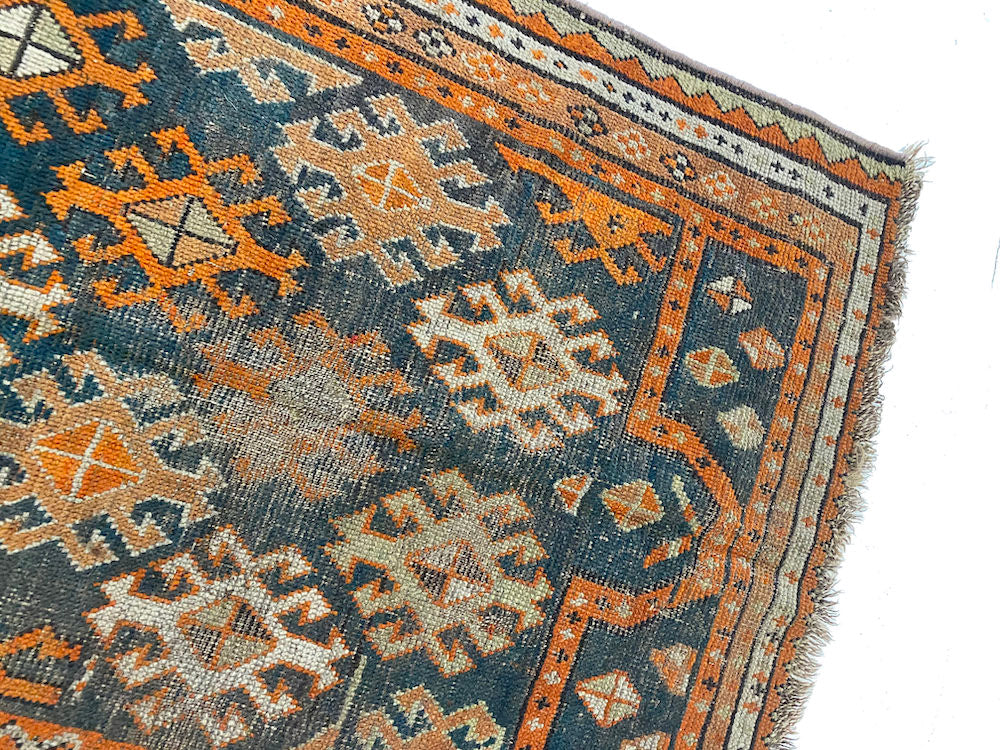 Hand woven antique Shirvan Persian Prayer Rug with blue base and orange, cream colored designs throughout - Available from King Kennedy Rugs Los Angeles 