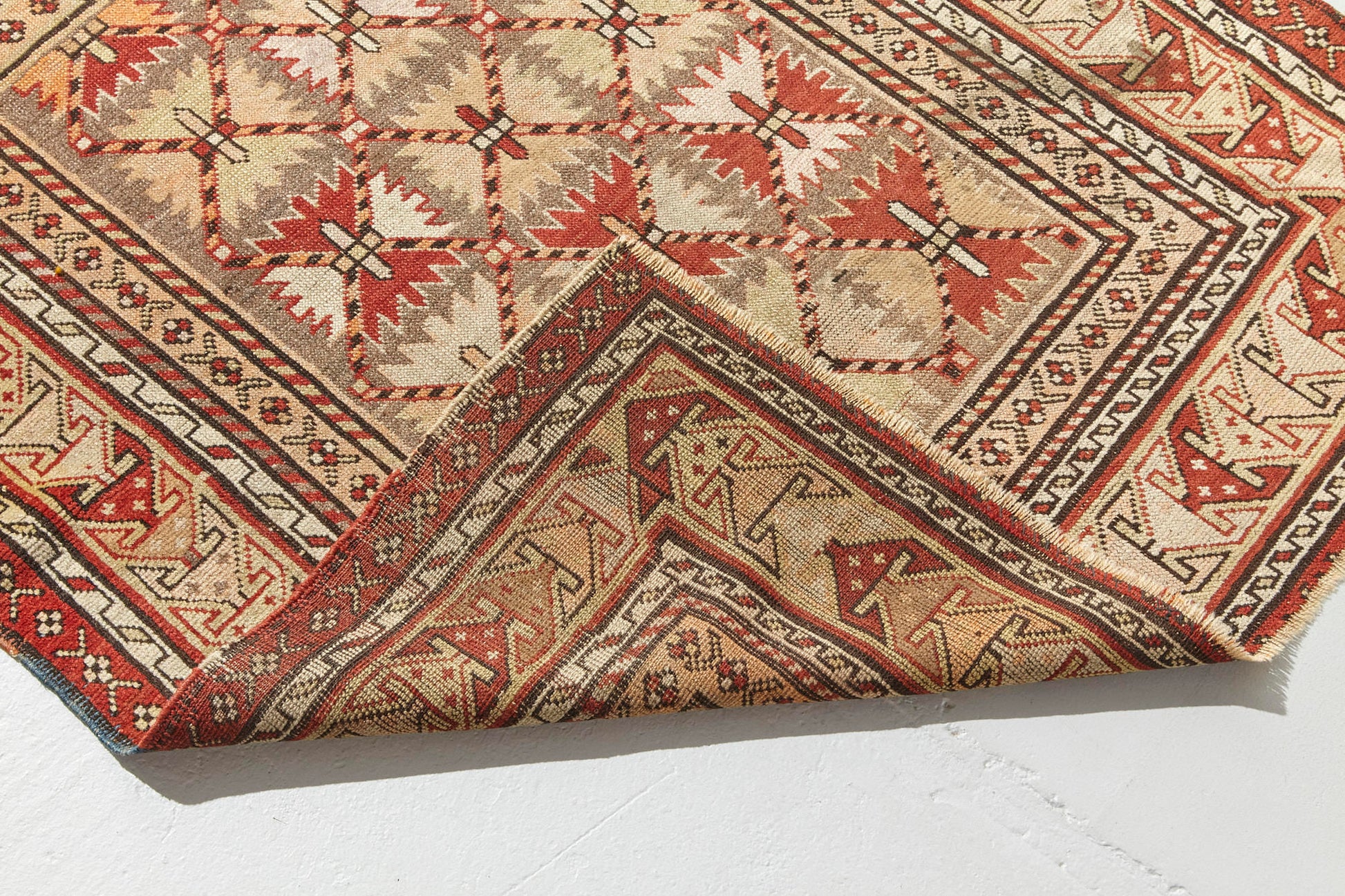Front and back of hand woven antique Shirvan Prayer rug, beige tan base with red, peach and brown designs throughout. Perfect for a bedroom, office, living room or as a wall hanging - Available from King Kennedy Rugs Los Angeles