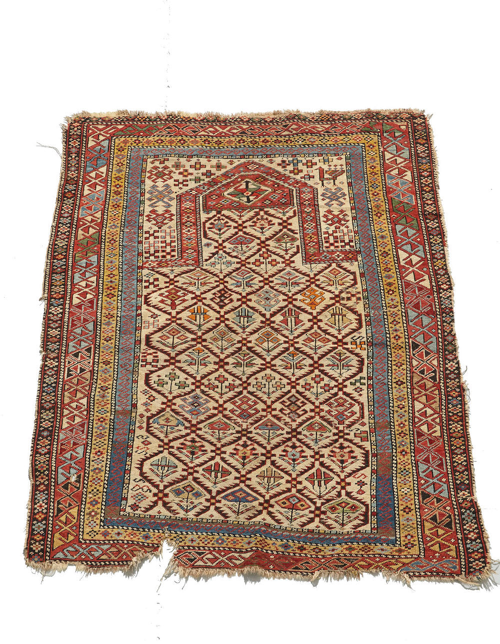 Shirvan Persian Prayer Rug. Intricately woven in beige, gold, green, blue and red with floral plant designs throughout. Perfect for a bedroom, study, bathroom or kitchen rug - Available from King Kennedy Rugs Los Angeles
