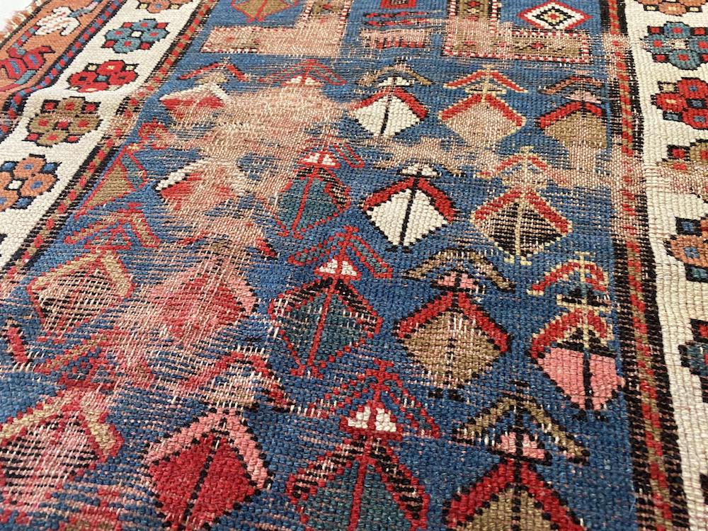 Antique, well worn Shirvan Prayer Rug with blue center and cream and gold border with flowers and vines - hand woven - Available from King Kennedy Rugs Los Angeles