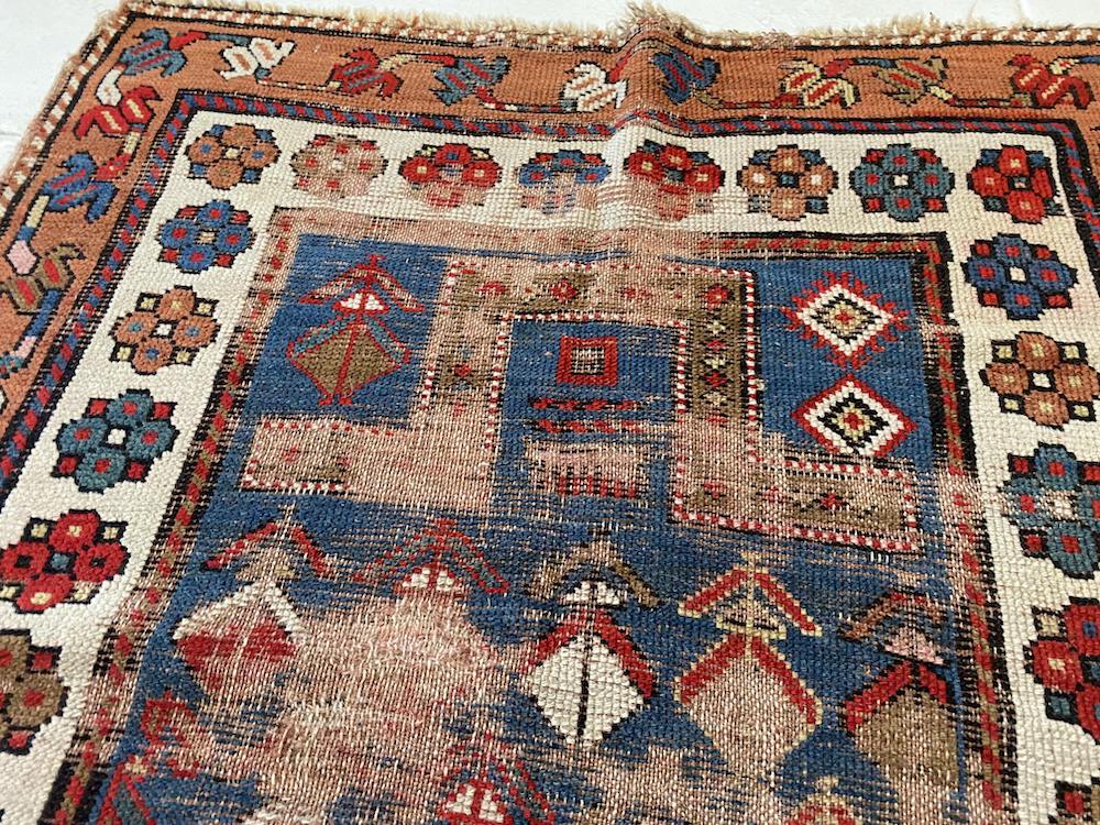 Antique, well worn Shirvan Prayer Rug with blue center and cream and gold border with flowers and vines - hand woven - Available from King Kennedy Rugs Los Angeles