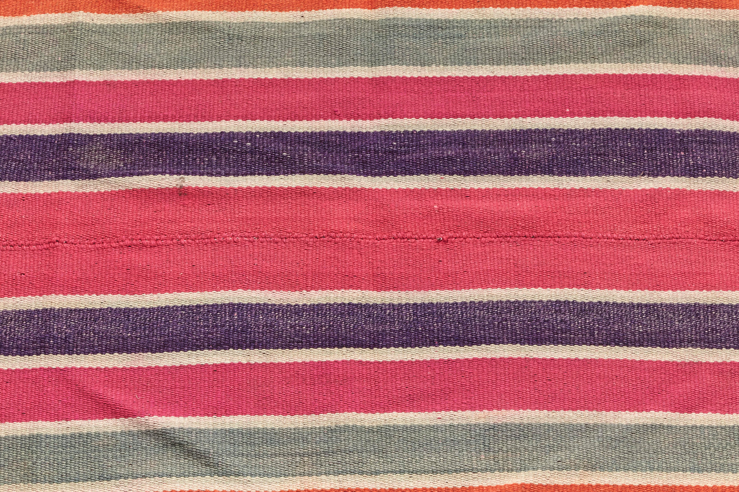 Guatemalan vintage rug with vibrant red, pink, purple and cream stripes, would be perfect for a bedroom, nursery or living room rug - Available from King Kennedy Rugs Los Angeles 