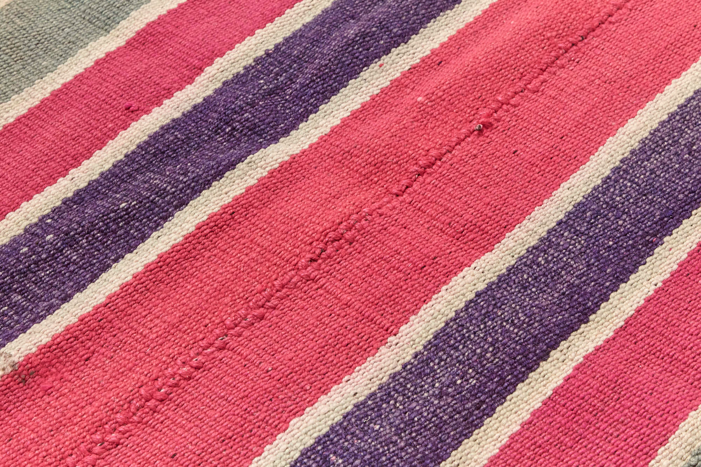 Guatemalan vintage rug with vibrant red, pink, purple and cream stripes, would be perfect for a bedroom, nursery or living room rug - Available from King Kennedy Rugs Los Angeles 
