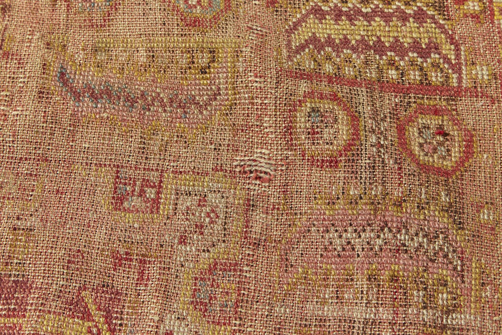 Intricately woven antique Turkish Prayer rug in red, yellow and beige. Perfect for a kitchen, bathroom or study rug - Available from King Kennedy Rugs Los Angeles