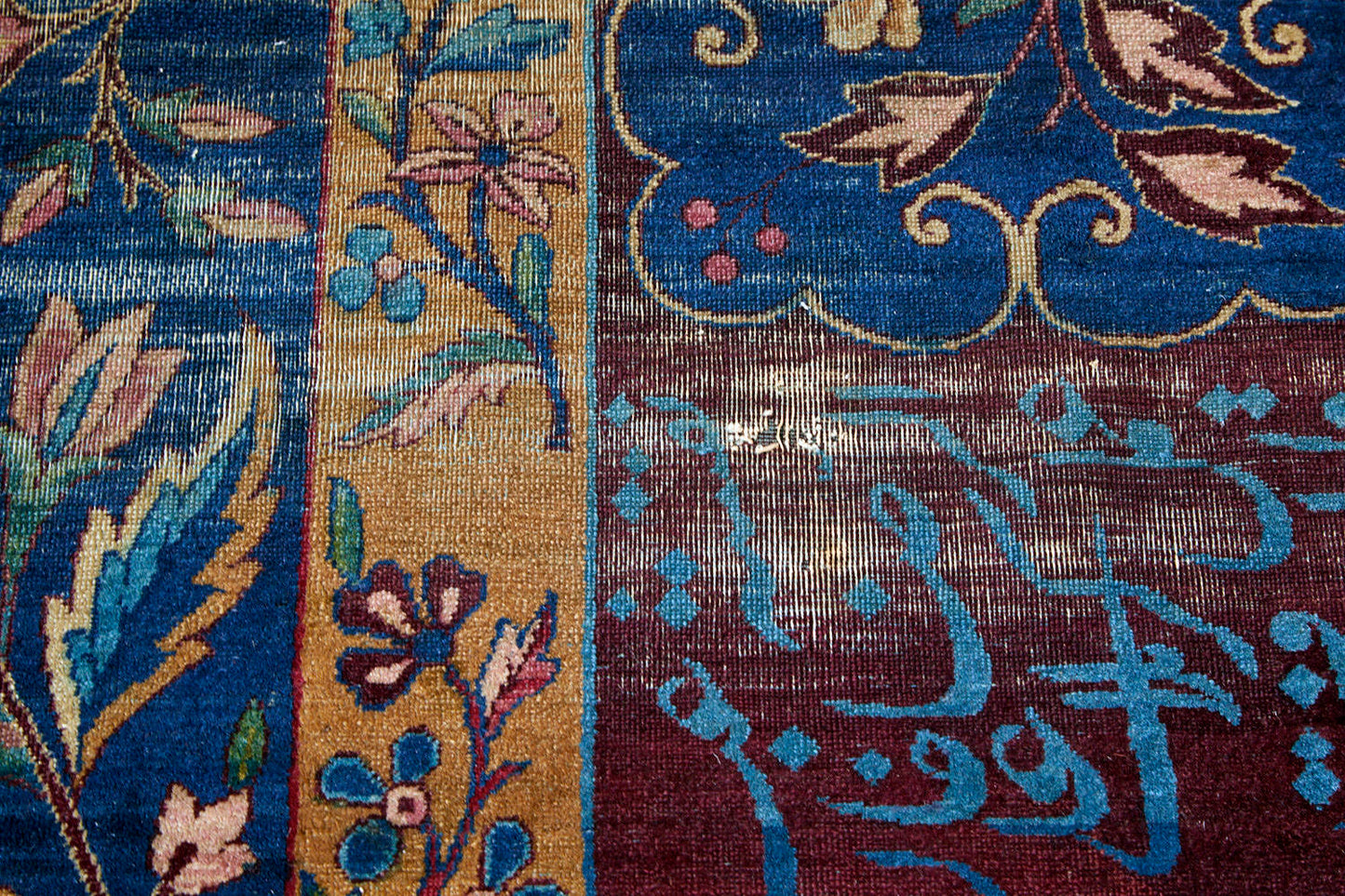 Blue Persian rug with gold and burgandy floral patterns and Arabic writing in the border, handwoven antique area rug - Available from King Kennedy Rugs Los Angeles