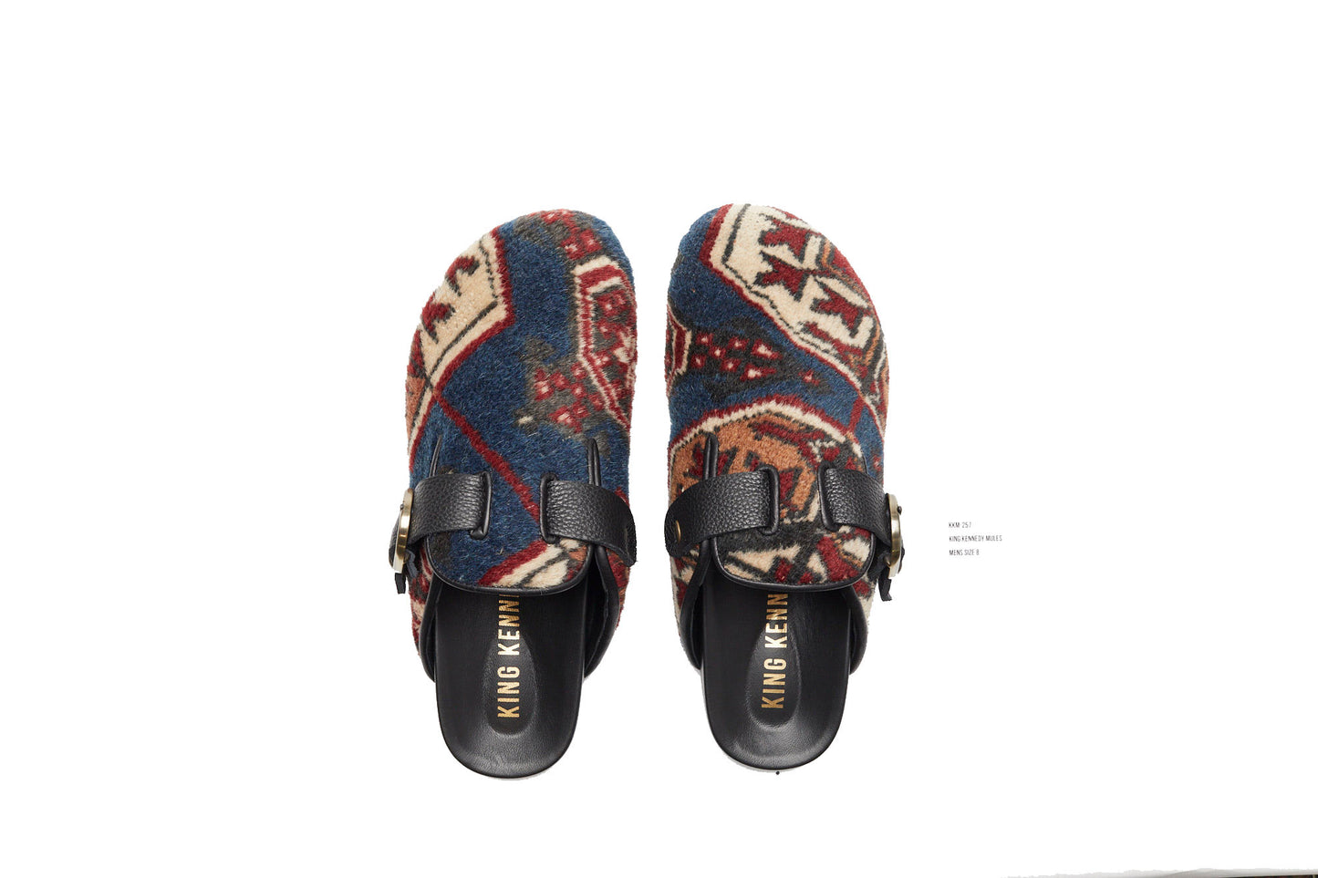 King Kennedy Rug Mules are one-of-a-kind and made of 100 year old antique Persian rug fragments with soft lambskin footbed and rubber sole. This pair is made of an antique Persian rug with deep blue base and cream, red and tan medallion designs. 