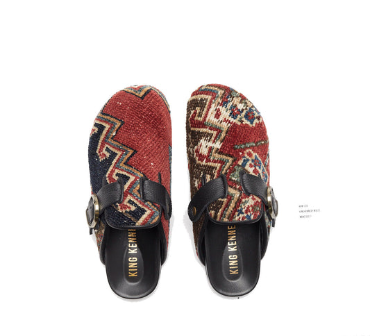 one-of-a-kind mule made of 100 year old antique Persian rug fragments with soft lambskin footbed and rubber sole. Similar in shape to the Birkenstock Boston clog. These men's size 7 are made of an antique red, blue and white rug with zig zag patterns.
